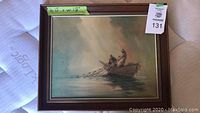 Front view of framed canvas print showing fishermen in boat scene with wood frame and green measurement tape.
