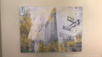 Canvas print showing New York Flatiron Building and street signs