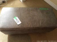 Full top view of beige rectangular bench showing upholstery and label titled 197.