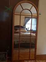 Full front view showing arched top and pane divisions