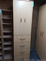 Front view of composite cabinet showing two doors on top and four drawers below.