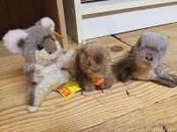 Three Steiff plush animals displayed together, showing the full lot with tags visible.