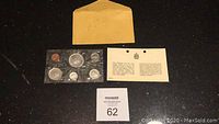 Original envelope labeled 1967 with sealed set of coins in plastic and certificate