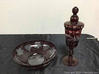 Full view of both ruby etched glass items: bowl on the left, covered jar on the right.