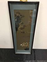 Full view of the framed Asian artwork wall hanging showing the overall size and framing