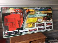 Full front of Bachmann Silver Lightning train set box showing train graphics and 147 piece count