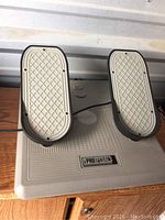 Top view of the Pro Pedals rudder pedals showing two textured foot pedals and the main base.