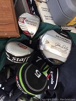 Three drivers showing TaylorMade Burner and John Daly 540cc heads with headcovers