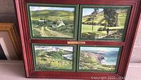 Four framed ceramic plates arranged in two rows within a larger red frame, showing Irish countryside scenes and blessings.