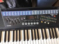 Top view of Casio Tone Bank CT-700 keyboard showing keys, control panel, and sound/rhythm options