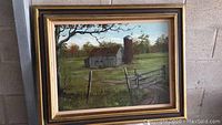 Full view of oil painting showing rural farm scene with barn, silo, and fencing in a natural setting.