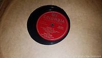 78 RPM black vinyl record with red Columbia label, showing artist Dinah Shore and song 'Daddy-O'