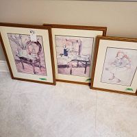 Three watercolour prints in matching wooden frames, two larger 12x16 inches and one smaller 10x12 inches, arranged side by side on floor.