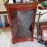 Front view of the wooden wine cabinet with glass door and lattice