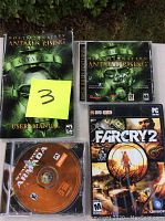 Three PC games with one manual: Star Trek Armada disc, Hostile Waters Antaeus Rising case and manual, Far Cry 2 case.