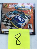 Photo of NASCAR Racing 2003 Season PC video game for sale showing front cover art of the game case with racing cars and ESRB rating