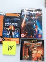 Lot includes three PC video game cases: Mass Effect (EA Value Games), Mass Effect 3, Command and Conquer Red Alert 2