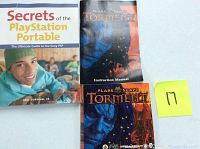 Photo of Planescape Torment instruction manual alongside Secrets of the PlayStation Portable book.