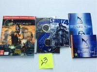 Photo of Outcast Prima Official Strategy Guide, SWAT 4 game case with discs, Deus Ex game manual and Prima strategy guides for Deus Ex and Outcast.