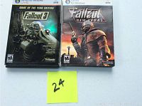 Two PC DVD games side by side: Fallout 3 Game of the Year Edition and Fallout New Vegas. Visible minor wear on cases.