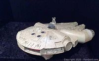 Front and side angle view of vintage Millennium Falcon toy showing detailed surface and general shape