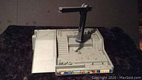 Photo of the Kenner Star Wars Jabba The Hutt Dungeon playset base showing the ramp, stairs, crane arm, and front decals.