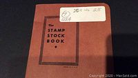 Cover of the stamp stock book labeled 'The Stamp Stock Book' with a white label indicating '20 to 25 USA'