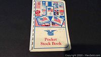 Front cover of the pocket stock book showing American flag and eagle themed illustrations with text 'Pocket Stock Book'.