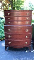 Front view of the full two-tier mahogany chest featuring six drawers.