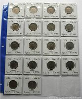 Full view of the 20 coins placed in holders with star numbers and denomination written on each holder, visible on a blue plastic sheet protector.
