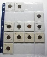 Front view of coin sheet with Canadian pennies dated 1920, 1921, 1927, 1928, 1929, 1930, 1931, 1932, 1933, 1934, 1935, 1936 in protective holders.