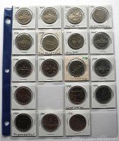Front sides of year set $1 Canadian coins from 1968 to 1986 (missing 1981) in coin holders on binder sheet