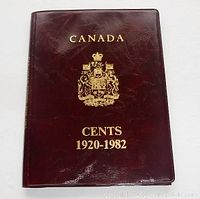 Front cover of the maroon slip coin folder embossed with 'CANADA CENTS 1920-1982' and crest.