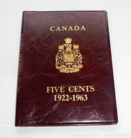 Front cover of dark maroon coin folder embossed with gold text 'CANADA FIVE CENTS 1922-1963' and Canadian coat of arms.