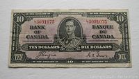 Front of 1937 Bank of Canada $10 bill showing King George VI portrait and Coyne-Towers signatures with serial number F3091075.