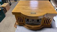 Closed wooden Philco record and CD player unit showing front panel with controls.