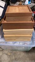Stack of 4 handmade wooden boxes showing different sizes and natural wood finishes.