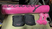 Pink Tracy Anderson yoga mat rolled up