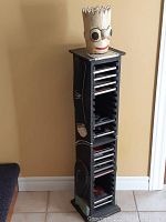 Front view of tall Bart Simpson wooden CD holder showing sculpted head and CD slots