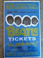 Front view of laminated Beatles poster showing all text and portraits of John, Paul, George, and Ringo with concert and ticket information.