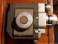 Side view of Sekonic Zoom 8 Simplomat Model 100 showing overall body and lens housing.