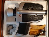 Bauer C3 Super 8 movie camera in original styrofoam packaging with accessories and manual.