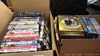 Photo showing multiple DVD titles, stacked and boxed, including The Best of Benny Hill, Moscow on the Hudson, Quantum Leap, and more.