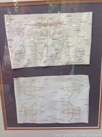 Front view of both birch bark biting artworks in single frame