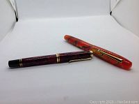 Two pens side by side on white background