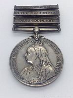 Full obverse view of medal with suspension bar and three clasps visible