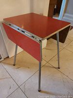 Table viewed from front left with drop leaves closed