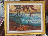 Framed painting front view showing artwork, mat and gold frame
