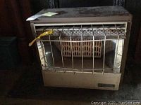 Full view of the Aspen natural gas space heater showing metal grill and outer structure.