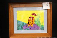 Front view of framed hand-painted animation cel showing the character and background from Journey Back to Oz